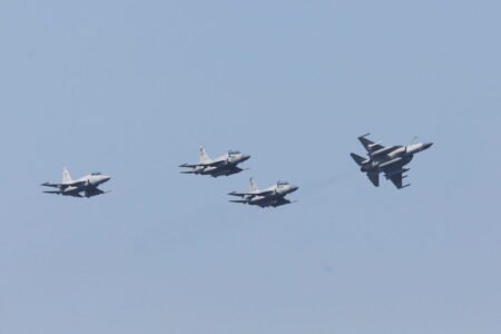Pakistani JF-17 Thunder jets flying in formation against a clear blue sky, symbolizing the military cooperation behind the Saudi-Pakistan Defense Pact drawing Islamabad into Yemen.