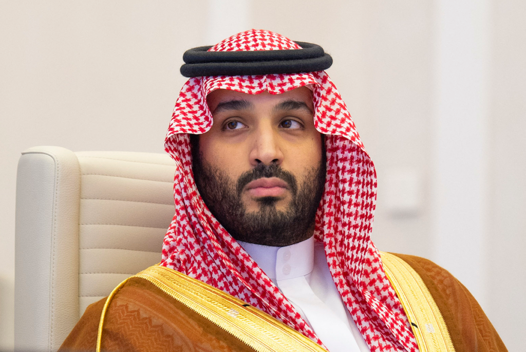 Saudi Crown Prince Mohammed bin Salman wearing traditional red-and-white ghutra attire, reflecting political dynamics surrounding Saudi Succession.