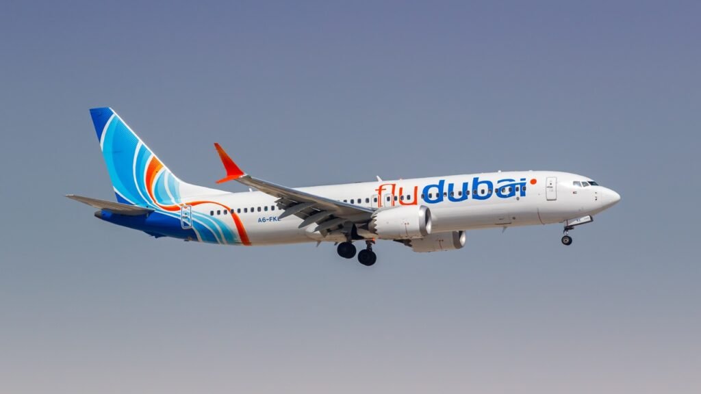 Lone Wolf Terrorism Tests US Counterterrorism Strategy A FlyDubai commercial passenger airplane flying against a clear blue sky, illustrating aviation security challenges and threats linked to Lone Wolf Terrorism.