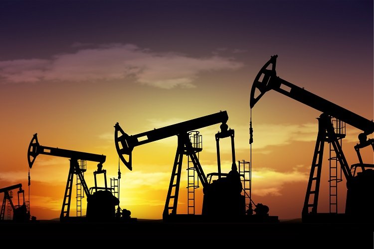 Oil Prices Fall When Rates Rise, Even in the Iran War Silhouetted oil pumpjacks operating against a sunset sky, illustrating energy supply dynamics and how Oil Prices adjust to interest rate hikes even during the Iran war.