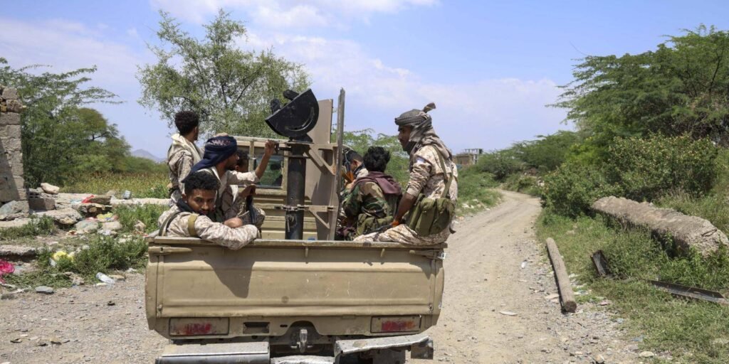 Yemeni government soldiers riding in a pick-up truck near the Taiz front line, highlighting why diplomatic Gulf Unity outweighs airpower in resolving the Yemen conflict.